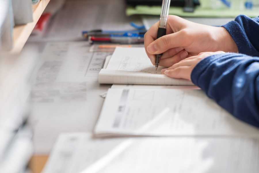 child is studying on the desk
